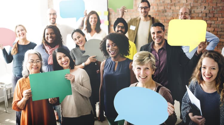 diverse colleagues smiling holding speech bubbles