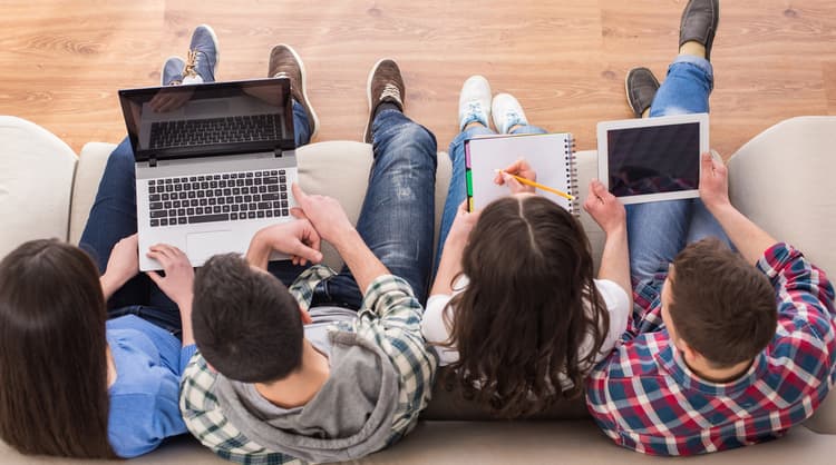 teenagers studying on couch