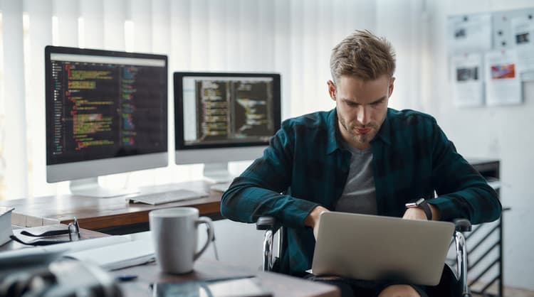 web developer working on laptop