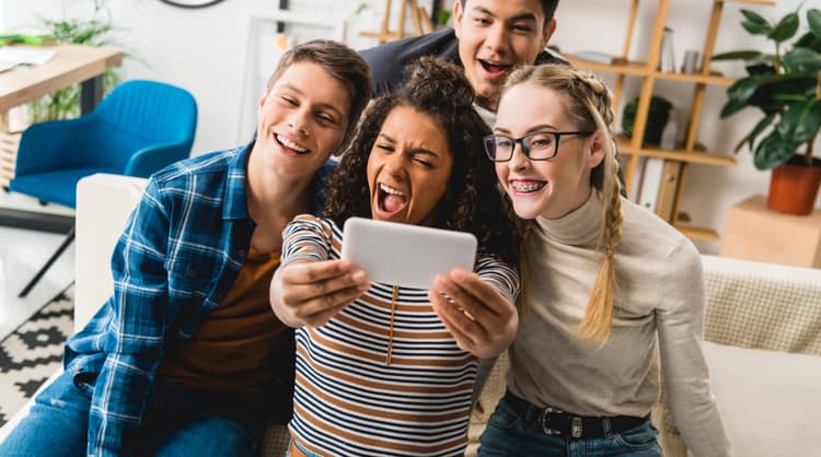 group of teenagers taking a photo together