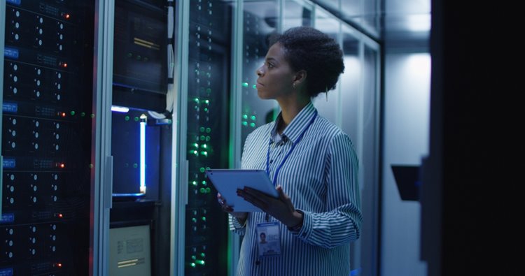 dark-skinned woman overseeing IT systems