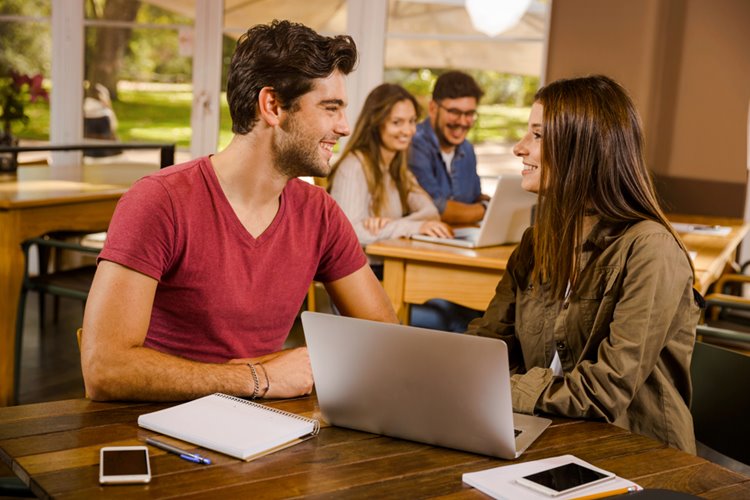 friends smiling while studying
