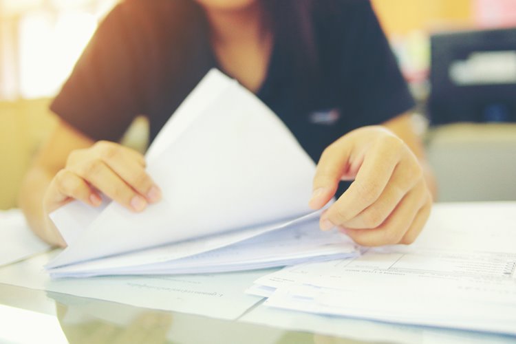 woman going through paperwork