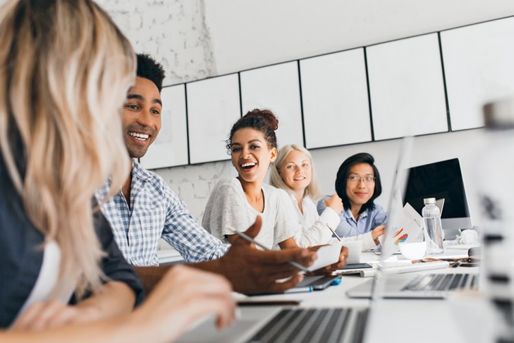 office employees happily having a meeting