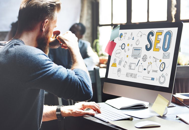man with beard working on SEO