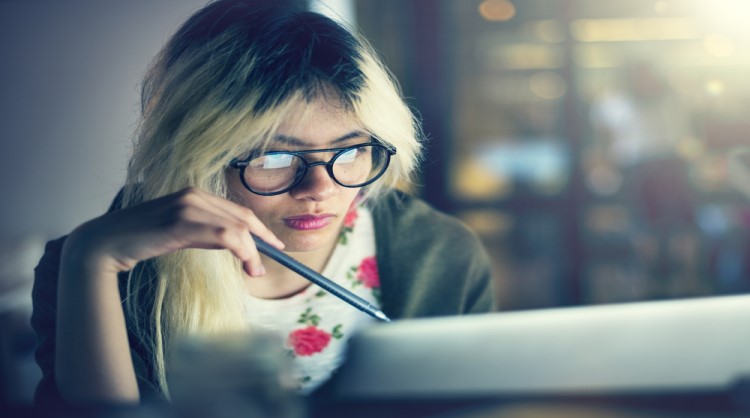 woman looking at computer screen