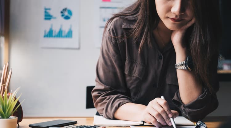 woman finance professional looking at expense reports