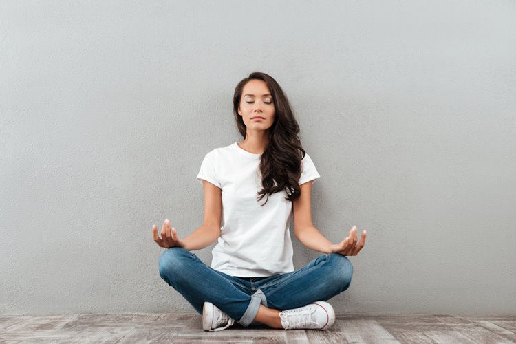 young asian woman meditating